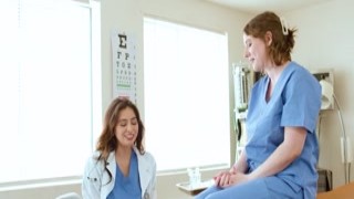 Doctor gives breast exam to busty intern